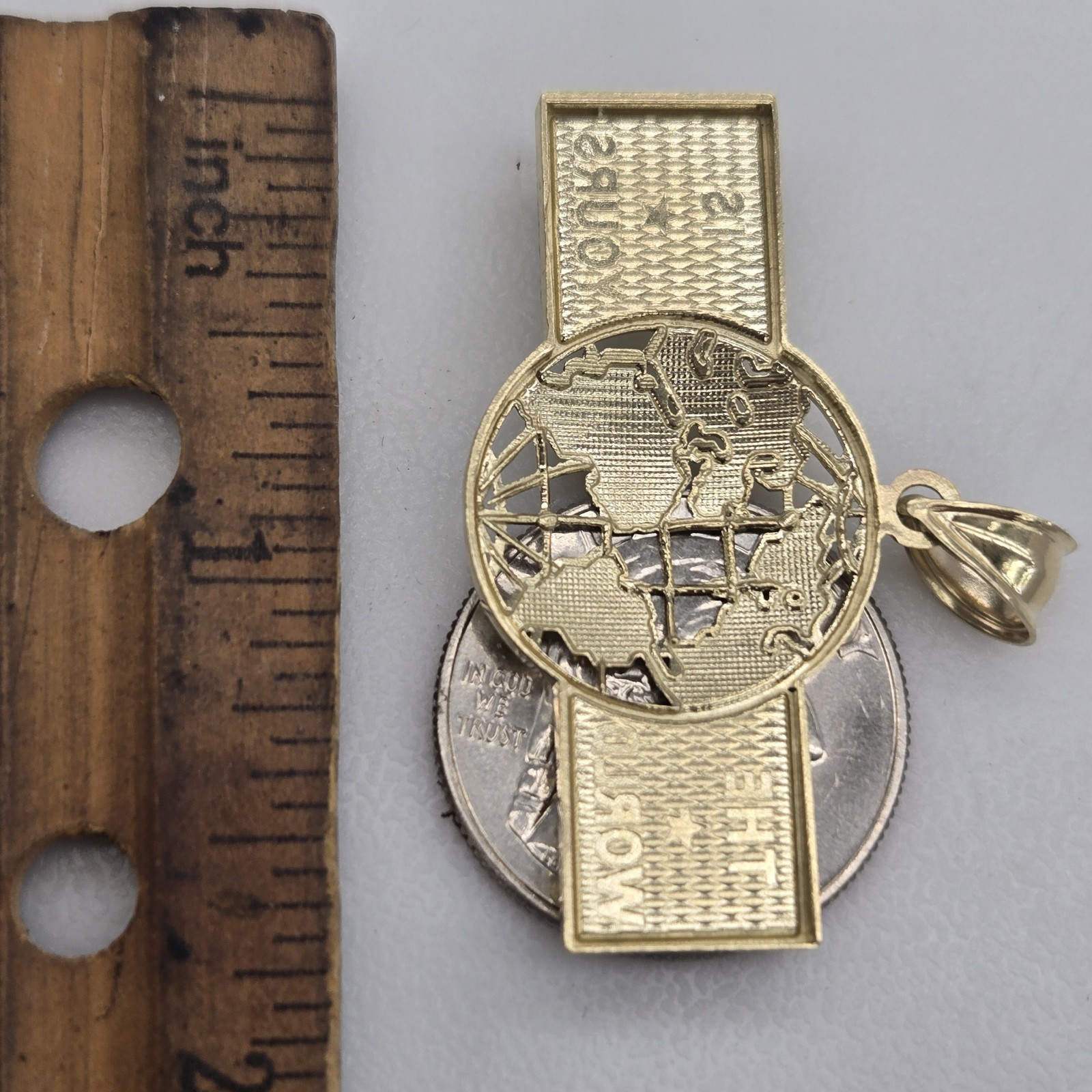 10k Yellow Gold The World Is Yours pendant