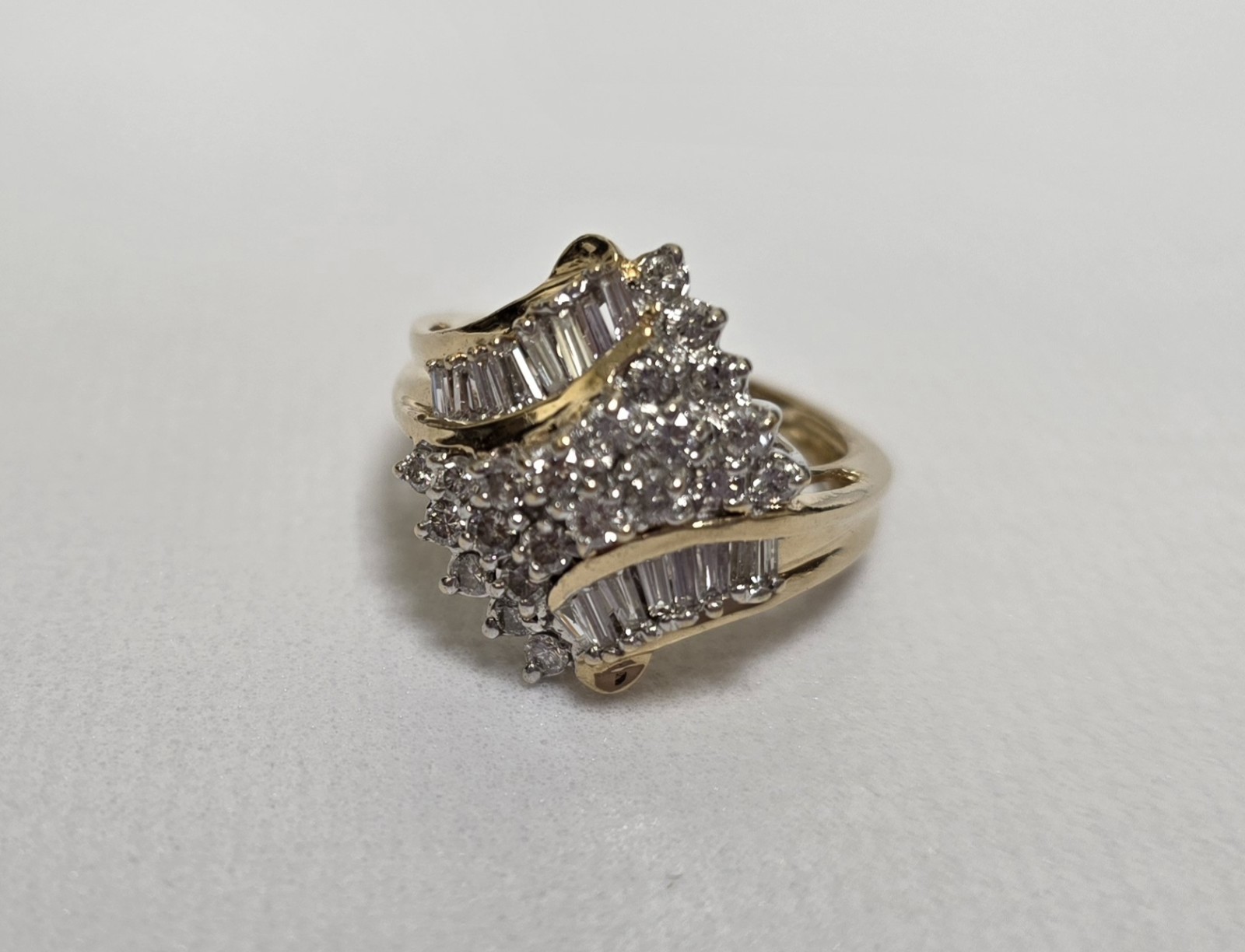 Ladies Diamond Cluster. 14 Karat Yellow Gold. Approx 1 Carat T.W Diamonds….