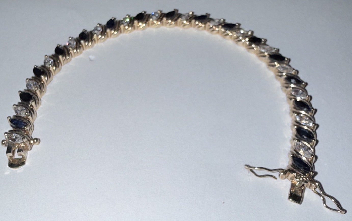 Sterling Silver Tennis Bracelet- sapphire stones. 7.5”. 20g t.w.