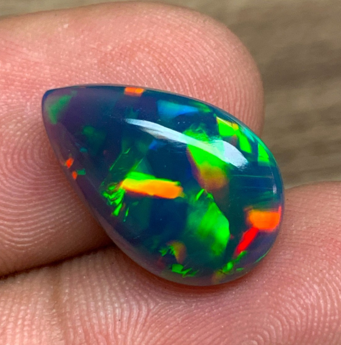 Ethiopian Opal Gemstone 4.65crt Pear Cabochon Black Welo Rainbow Flash Gemstone