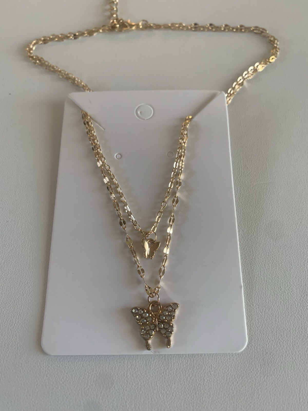 Gold Tone Layered Butterfly Charm Necklace with Clear Crystal Pendant, 16.14″