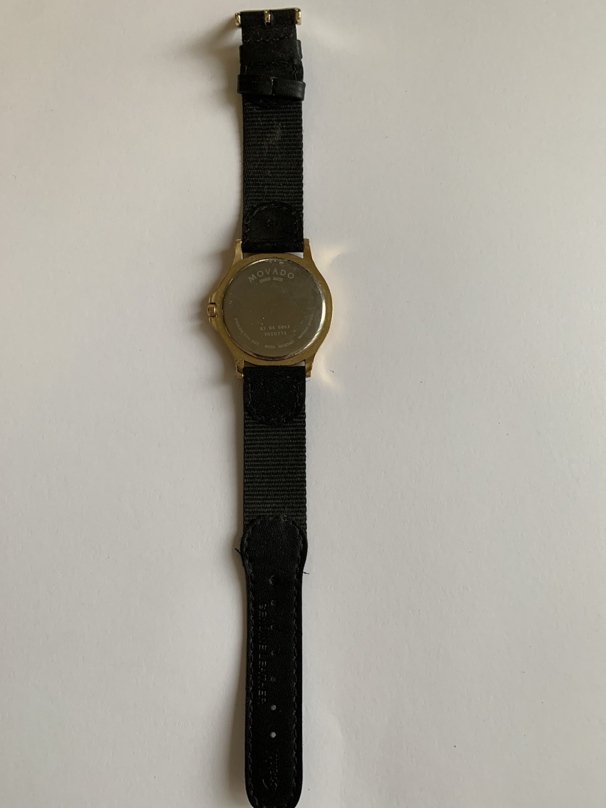 Movado Swiss made Sapphire Crystal Quartz Watch. Working-needs battery