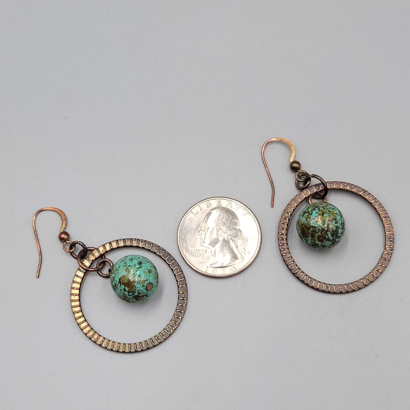 Bronze tone Dangle Pierced Earrings Green Bead Center Dangle 1.5″
