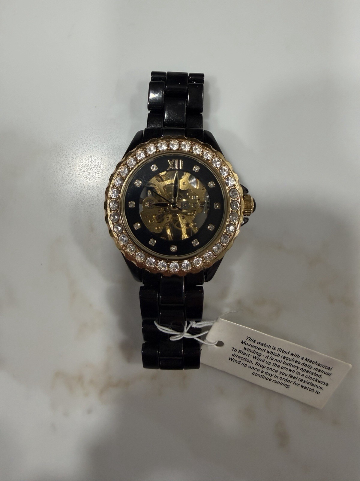Adrienne Women’s Black Ceramic Skeleton Watch Crystal Bezel Gold Tone New