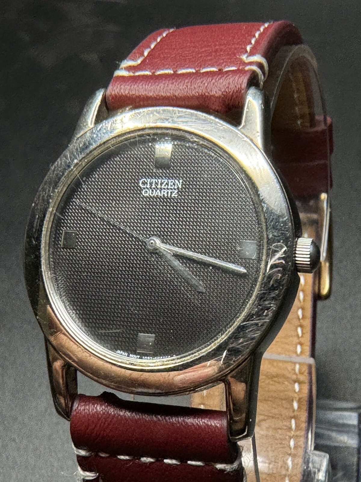 Citizen Quartz Silver Tone Dark Gray Dial Number-Less Watch Burgundy Strap