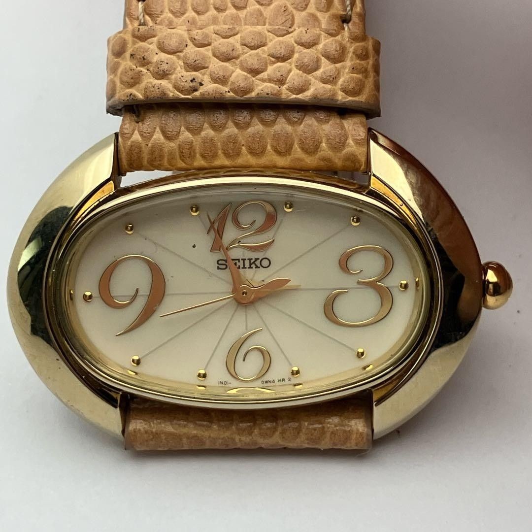 Working item SEIKO wristwatch oval quartz new battery ladies