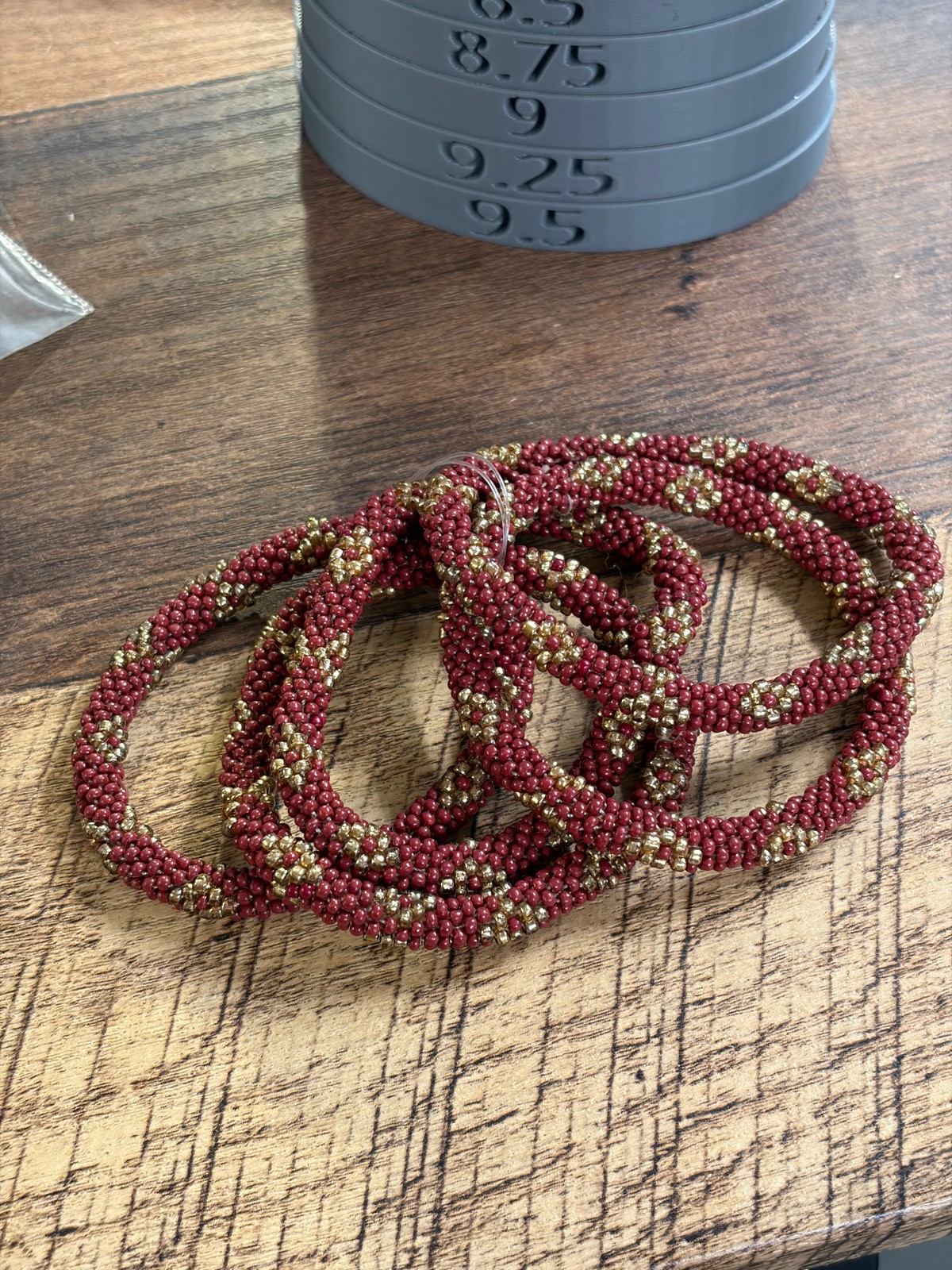 Handcrafted Nepalese Roll-On Seed Bead Bracelets – Burgundy & Gold Spiral
