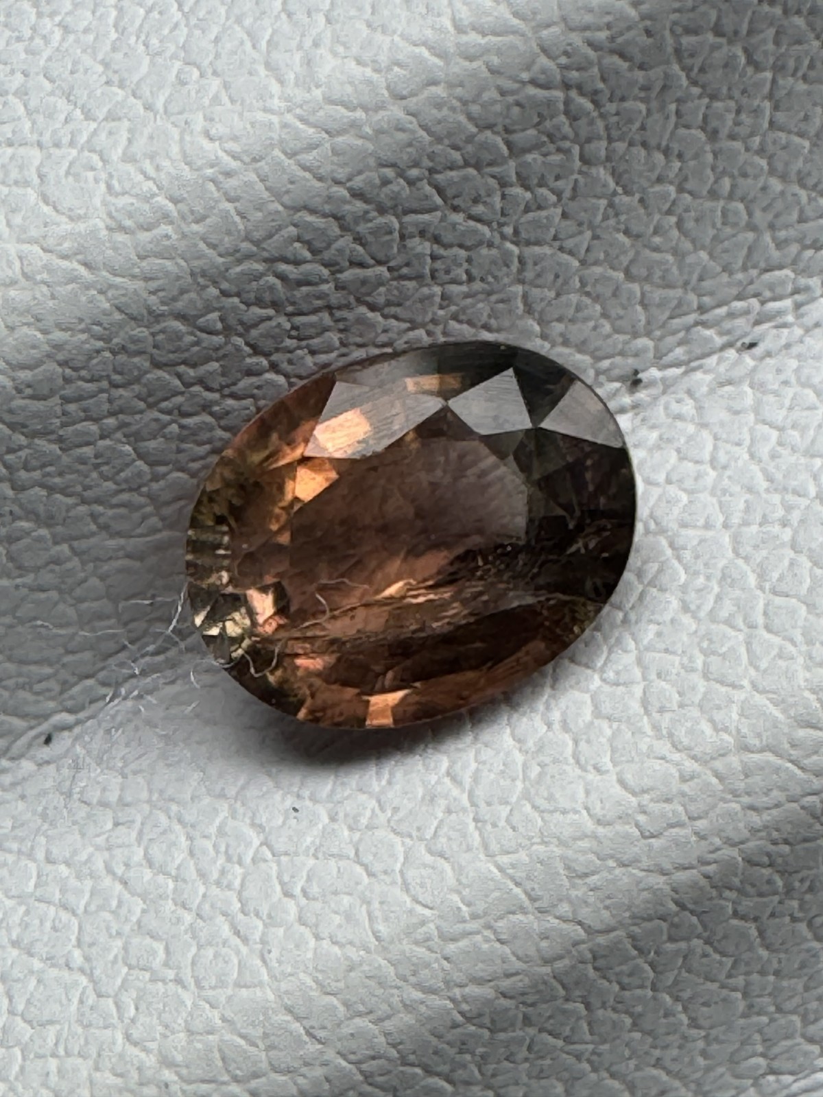 TOURMALINE. Cognac Oval, Very Slight Inclusion. 7.9 X 6.1 mm, 1.27 Carats.