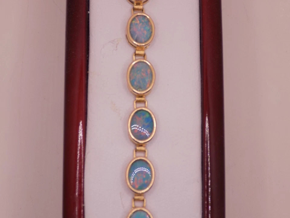 7.00Ct Oval Lab Created Fire Opal Women’s Tennis Bracelet 14K Yellow Gold Plated