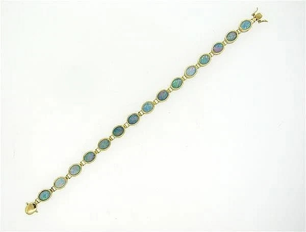 7.00Ct Oval Lab Created Fire Opal Women’s Tennis Bracelet 14K Yellow Gold Plated