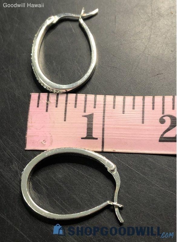 classic oval hoop earrings feature a polished silver-tone finish accented by a