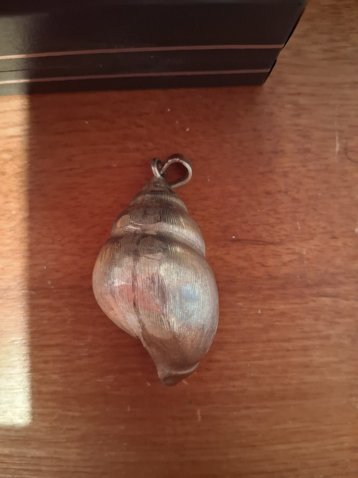 925 Silver Conch Shell Pendant weighing 16 grams 1 3/4 inches long.