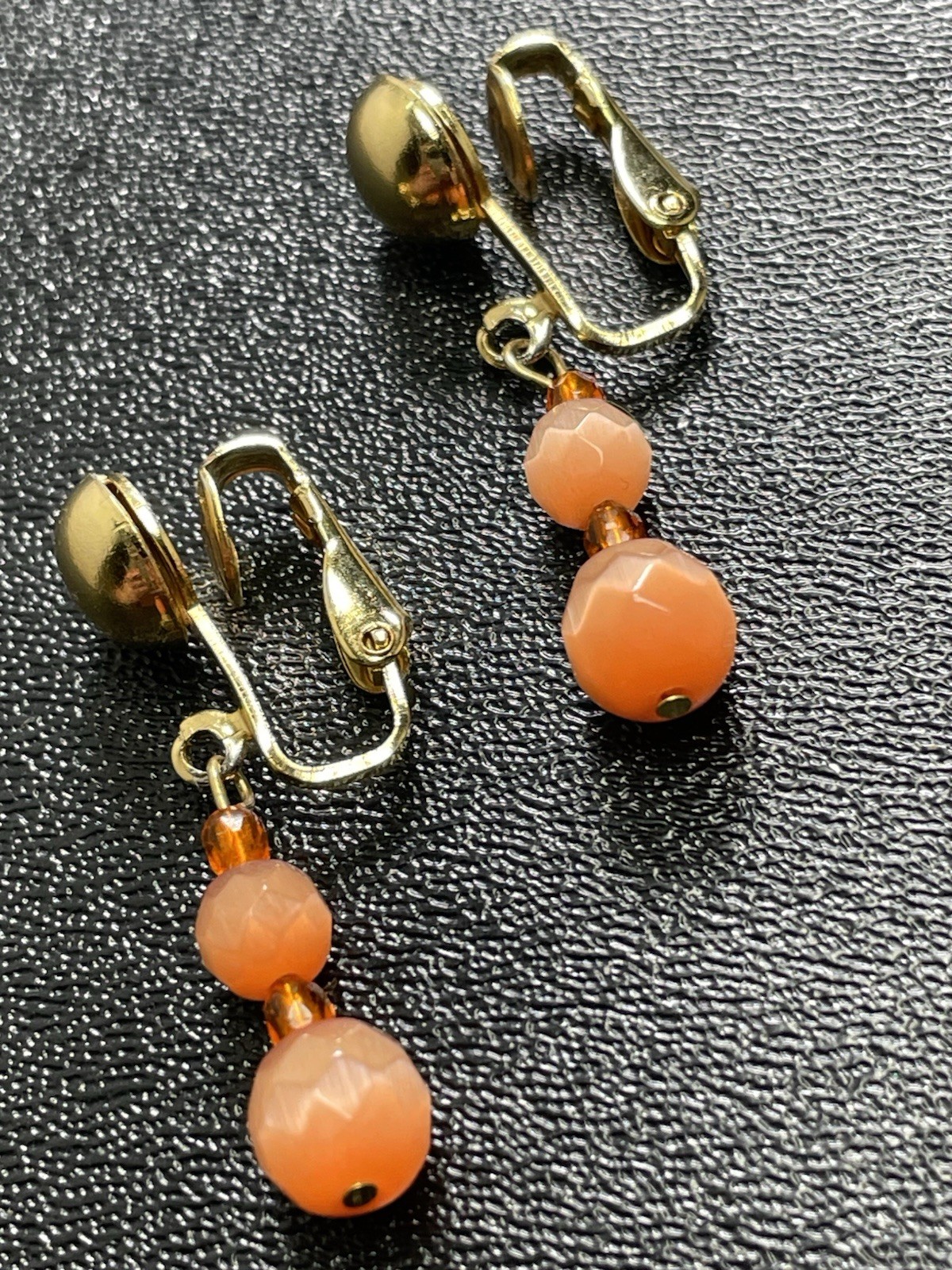 Vintage 1.4” Orange Faceted Art Glass Gold Tone Dangle Clip Earrings