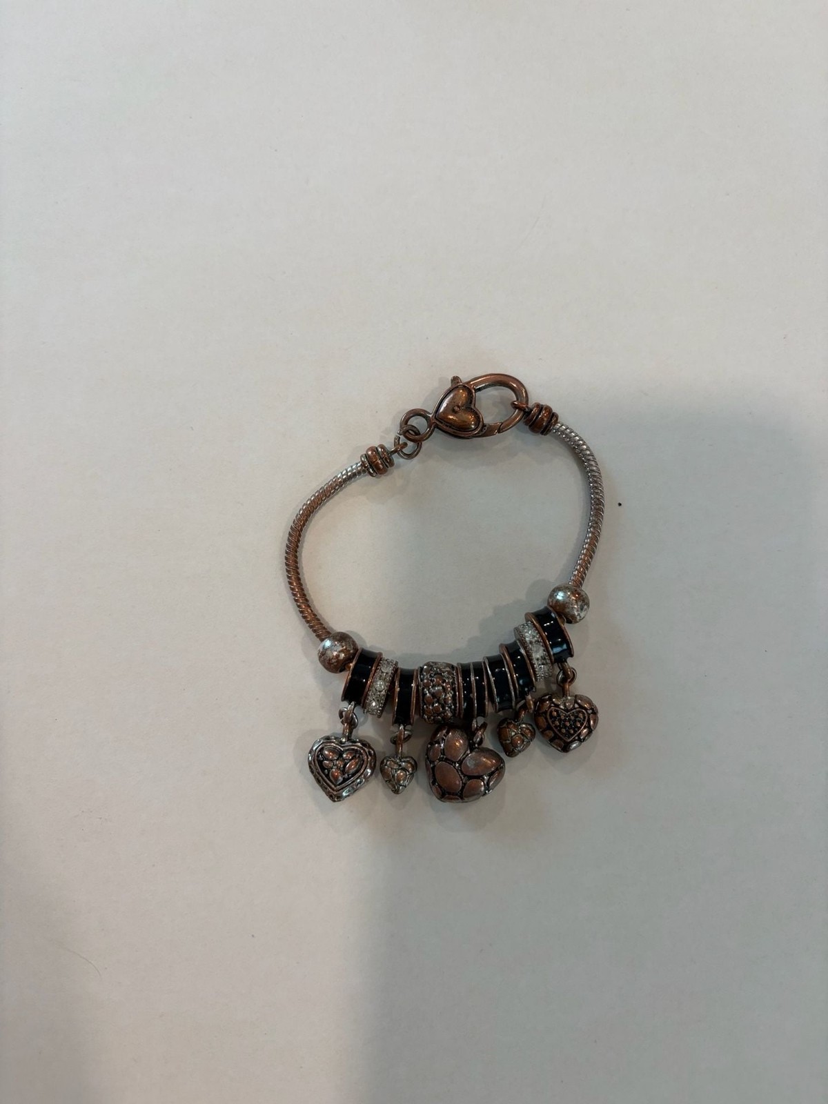 Set of 5 Rose Gold Tone Fashion Bracelets, a Ring and a Charm