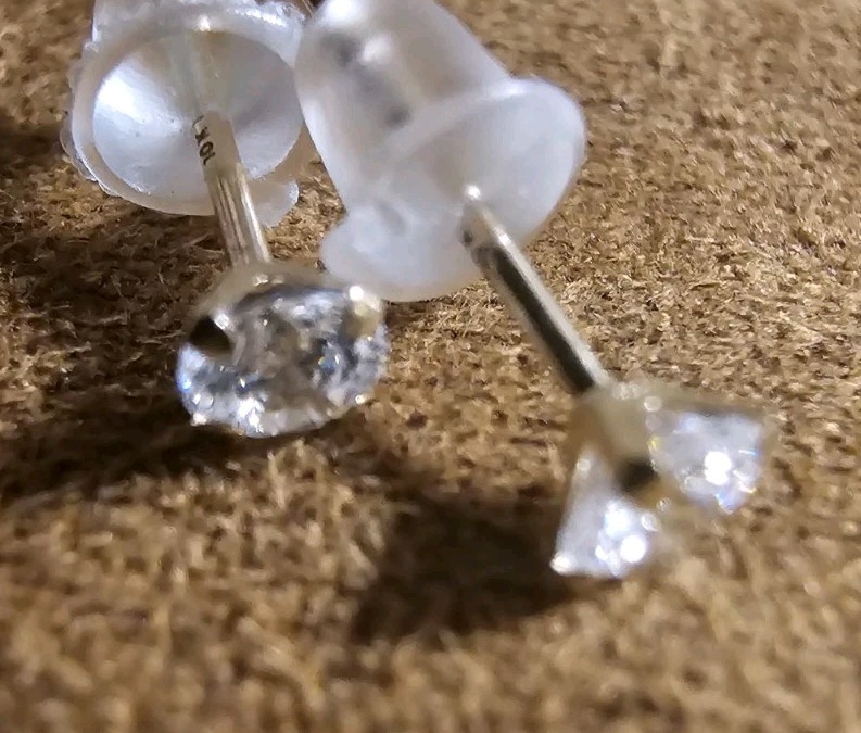 Tiny Round Moissanite Stud Earrings in 10k Yellow Gold