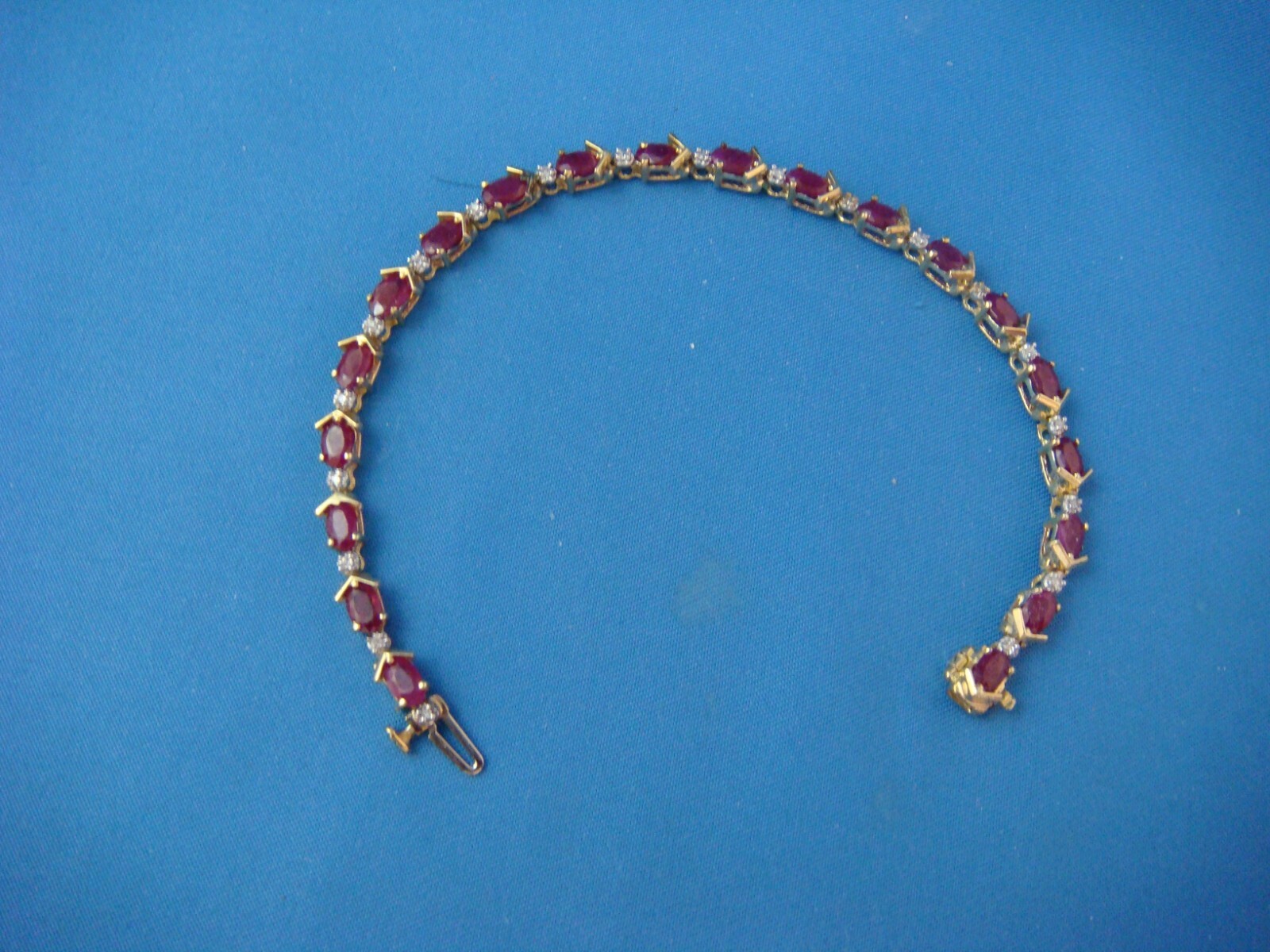 14 KT YELLOW GOLD GENUINE RUBY AND DIAMONDS TENNIS BRACELET 8.8 GRAMS 6.5 “