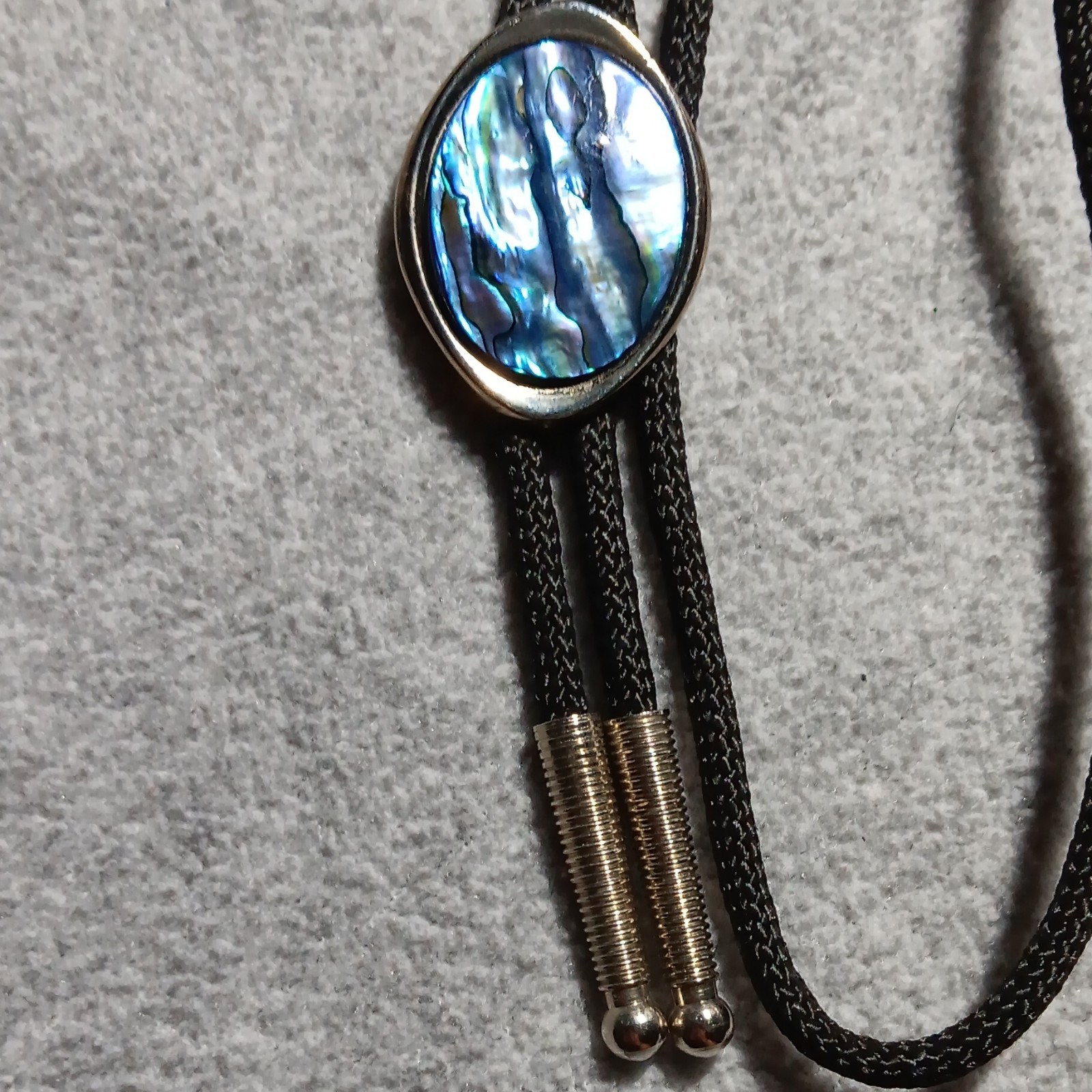 Men’s Western Bolo Tie Black Cord Oval Blue Mother of Pearl/Abalone Slide
