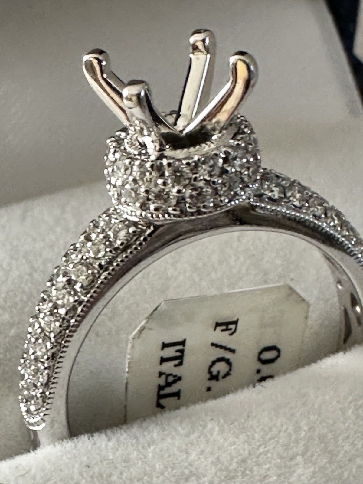 14kt,white gold semi mount ring with 0.62ct, VS2 clarity size 6, 4.40 grams.