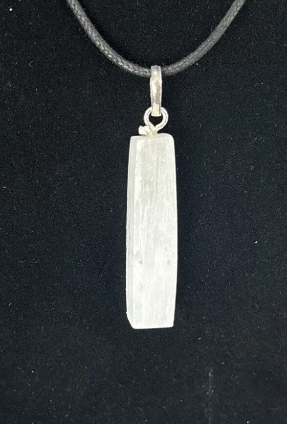 Selenite top drilled pendant with silver colored bail and adjustable cord