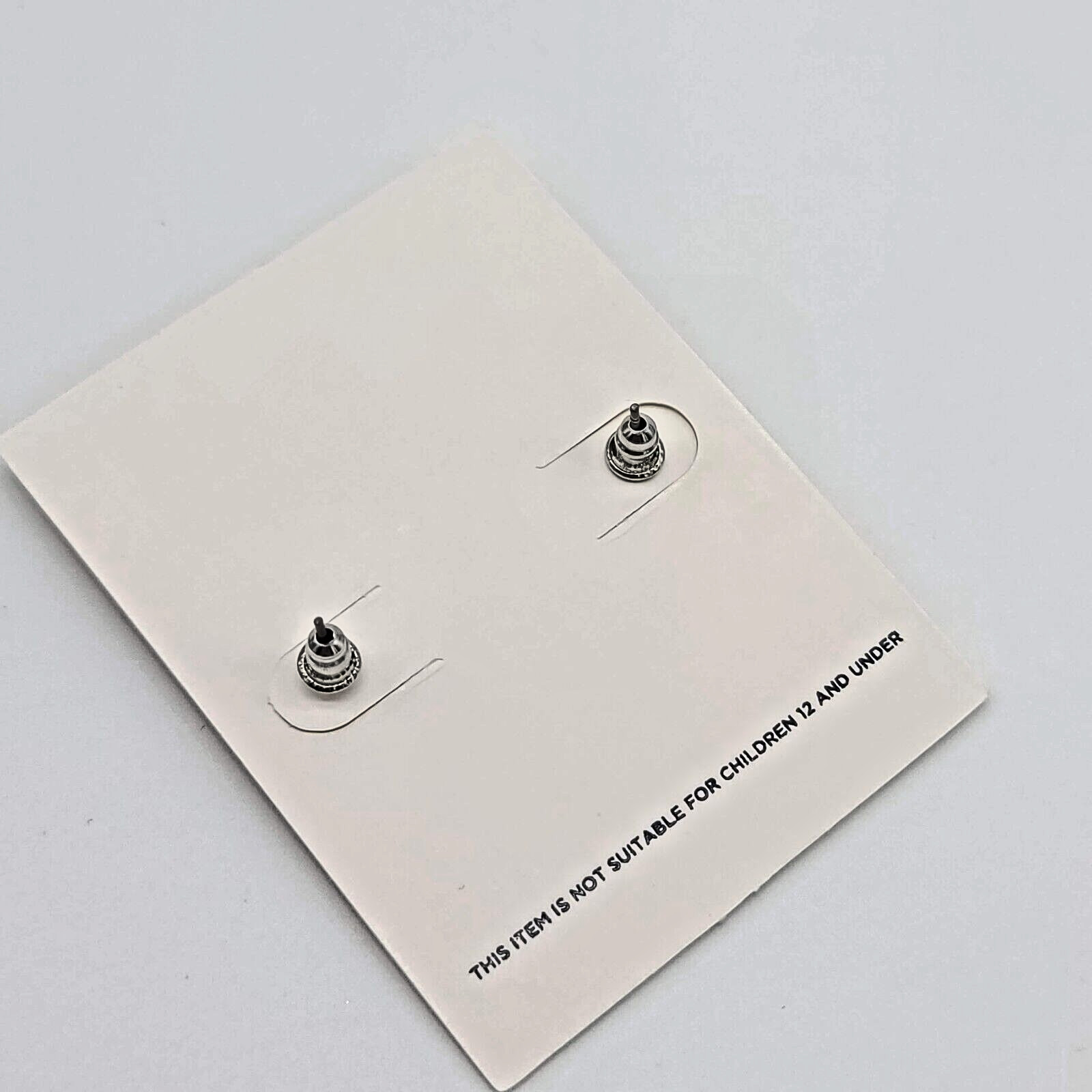 7 Charming Sisters “Spring Cleaning” Minimalist Silver Knot Stud Earrings