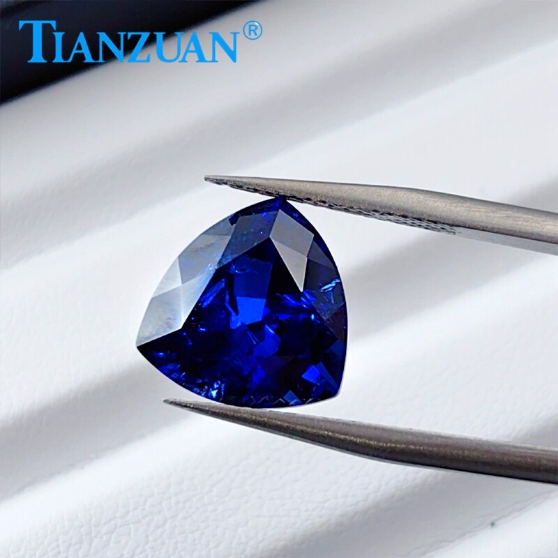 Lab Created Trillion shape Royal Blue Sapphire loose gemstone with Inclusions