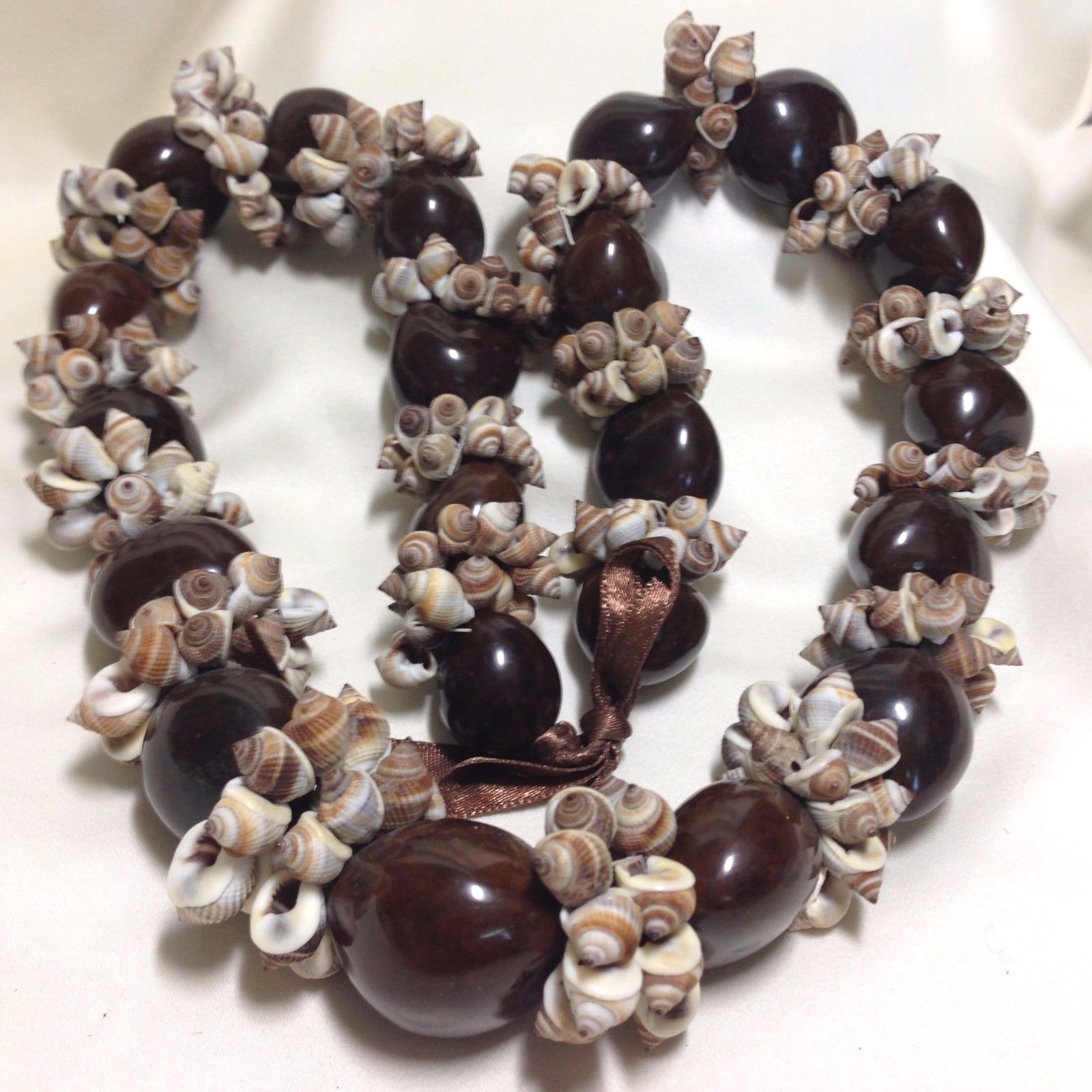 24-28-inch Kukui Nut/Seed & Nassa Shell Lei with Brown Ribbon, Adjustable