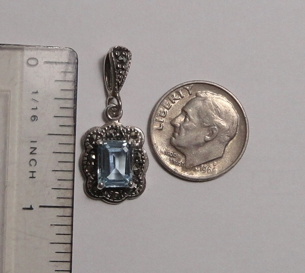 Emerald Cut Aquamarine and Diamond Accent Pendant in Sterling Silver