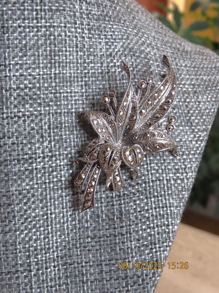 Marcasite pin; flower design set in silver; 2 1/2 by 1 1/2 inches
