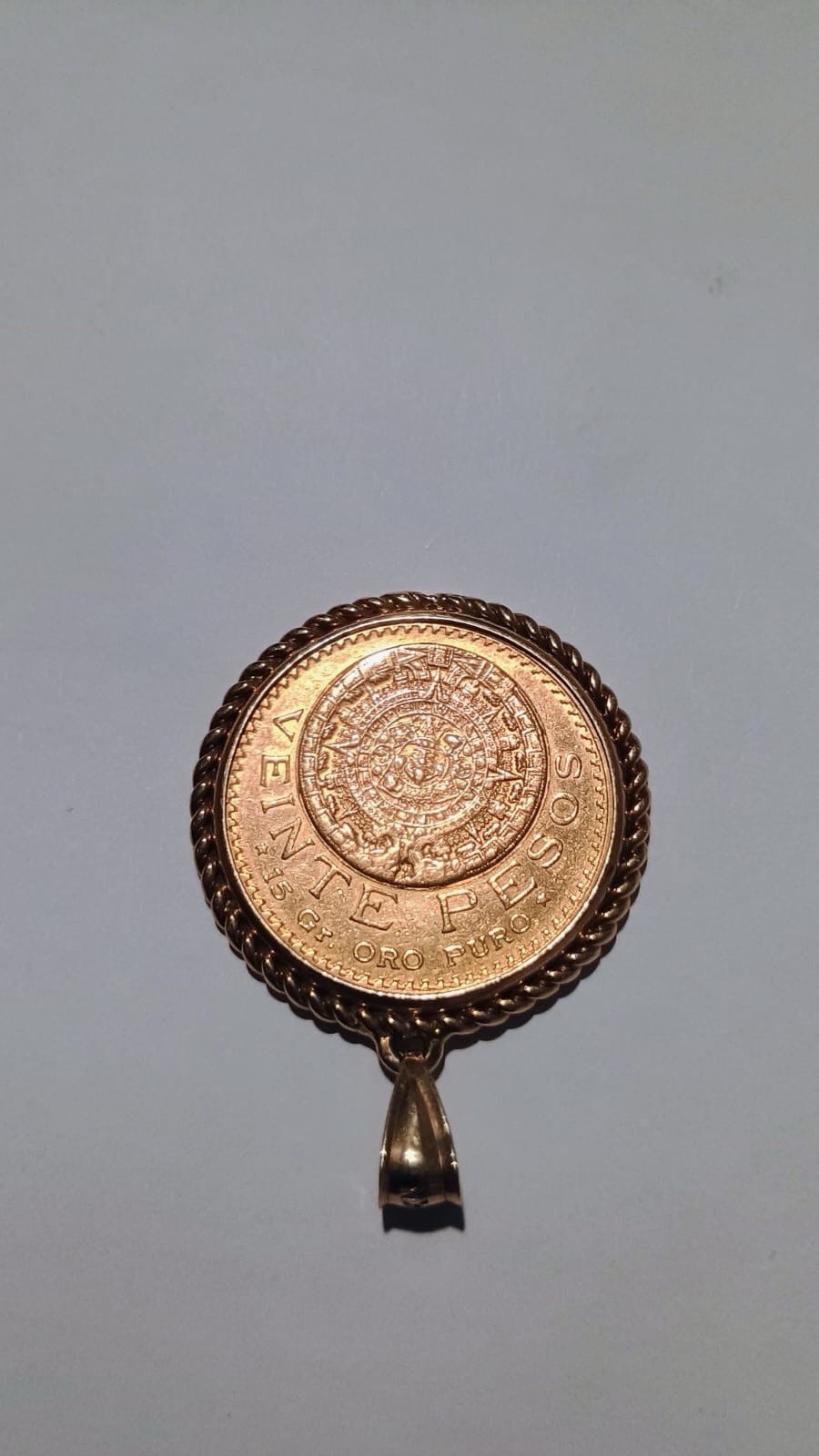 1918 Mexican “Veinte Pesos” gold coin pendant, featuring a 14k gold bezel