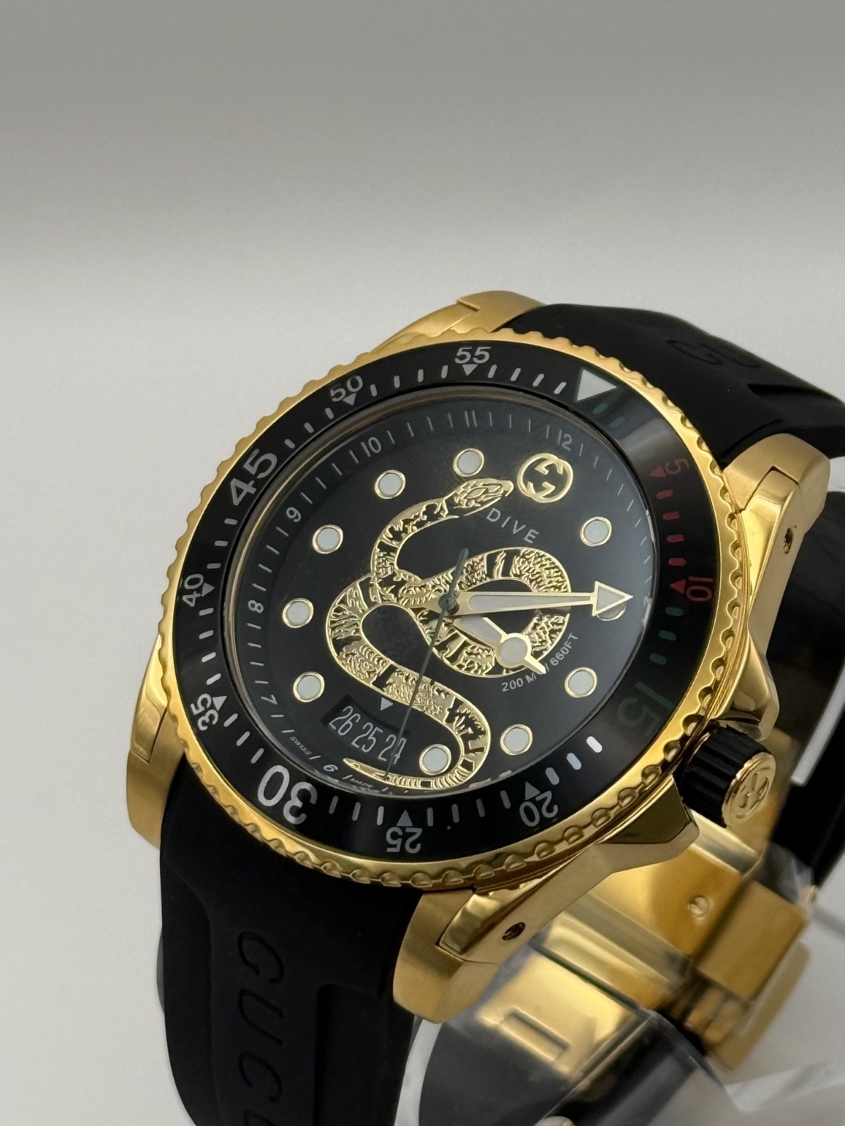 Gucci Dive Black Dial Gold-Tone Rubber Strap 45mm. Men’s Watch YA136219