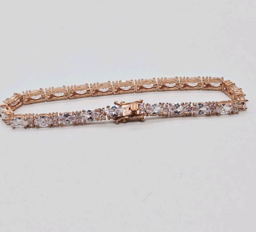 Tennis Bracelet White Oval Crystal rhinestone signed 925 Rose Gold tone 7.25 in