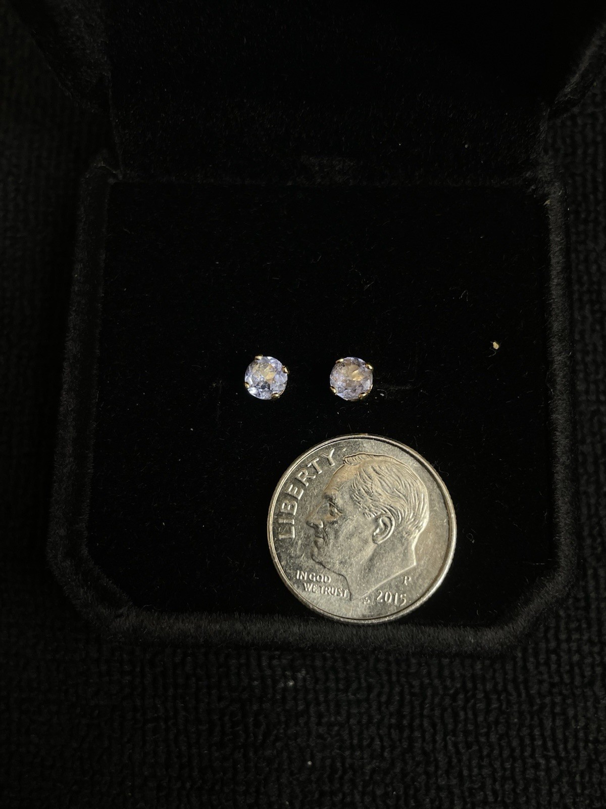 14k round cut tanzanite stud earrings. They don’t come clutch’s