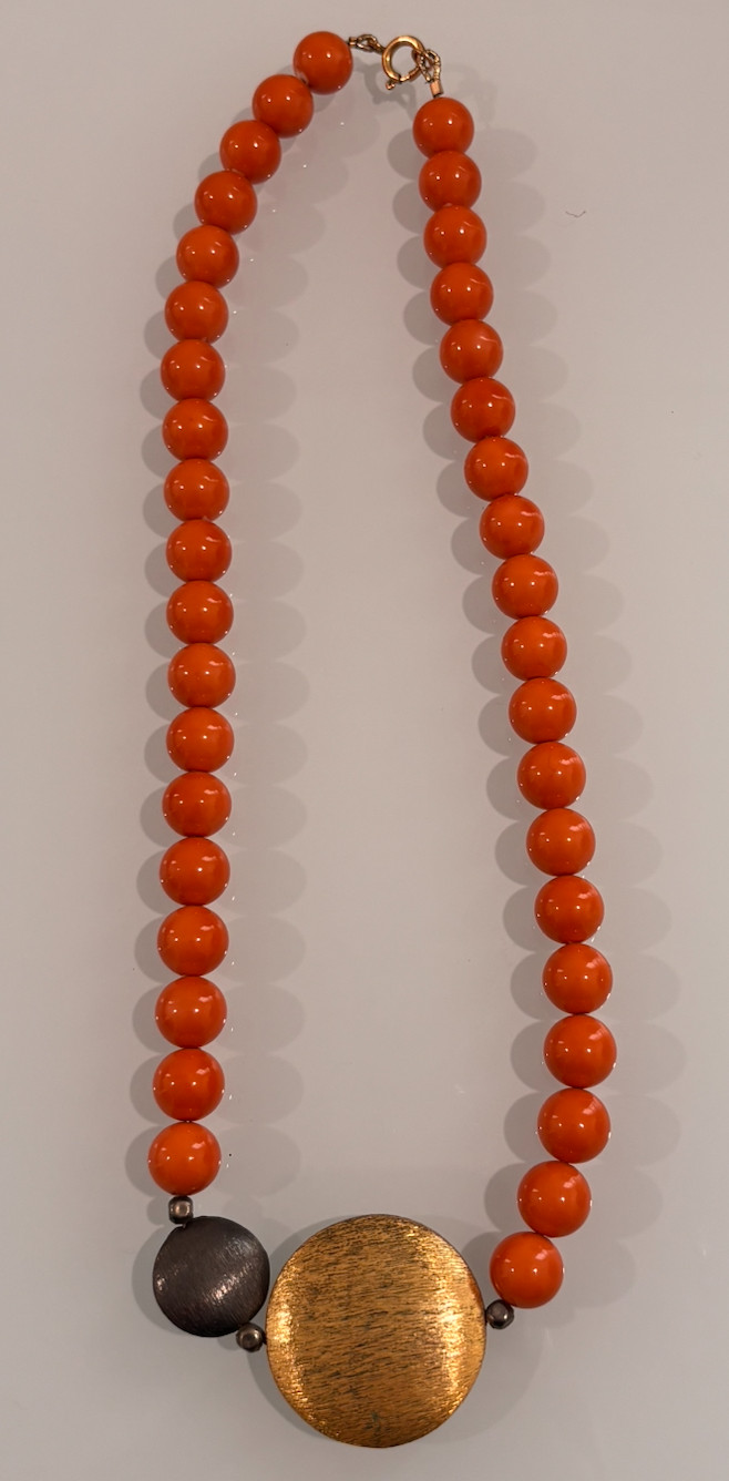9″ Orange Bead Necklace with Gold Textured Pendant and Dark Accent Beads