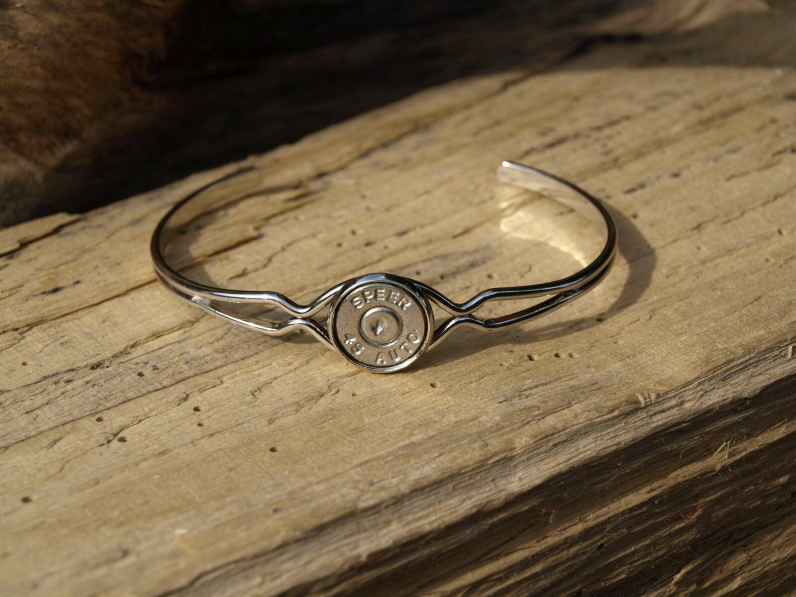 Thin Silver Cuff Bracelet with 45 Auto Bullet Casing. Optional Crystal