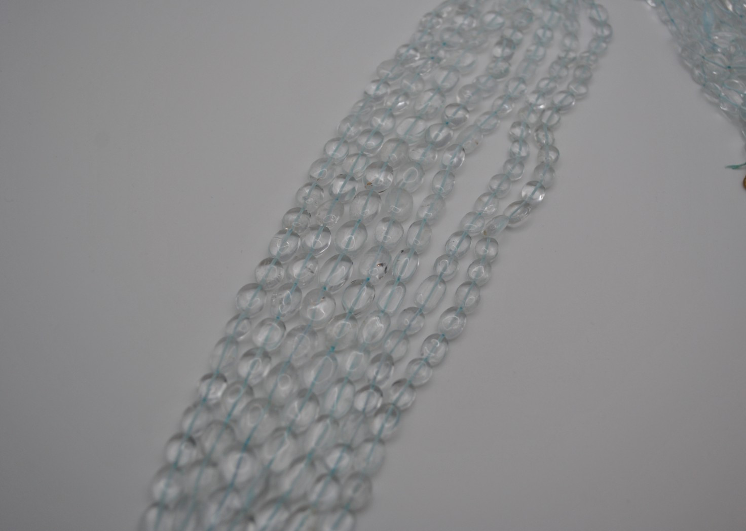 Topaz Oval (Dyed) Gemstone Strand with Smooth Stones (No Clasp)