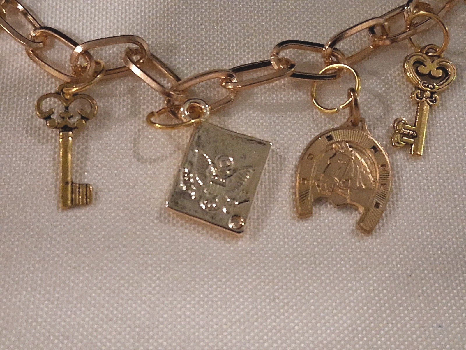 Goldtone Dangle Charm Bracelet, 6 Charms:Horse,Crown,Keys,Mushroom& Amer. Eagle
