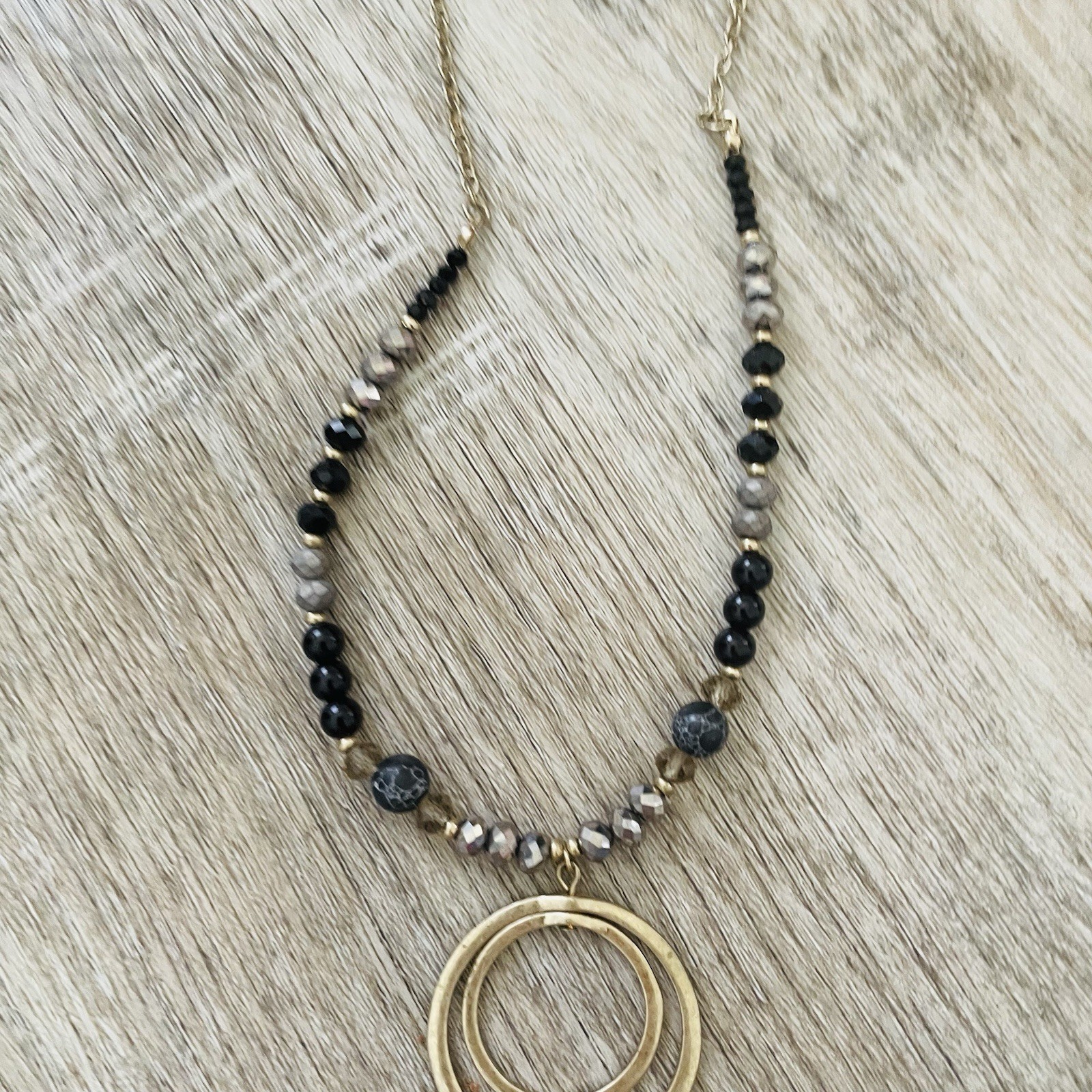 Gold Double Ring Pendant Necklace with Black and Gray Beads