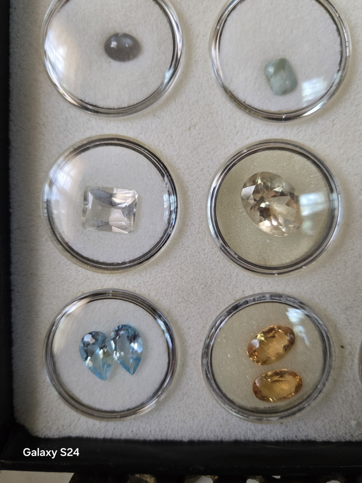 Lots Of Loose Faceted Mixed Colors Gemstones In A Display Case- ** ESTATE…