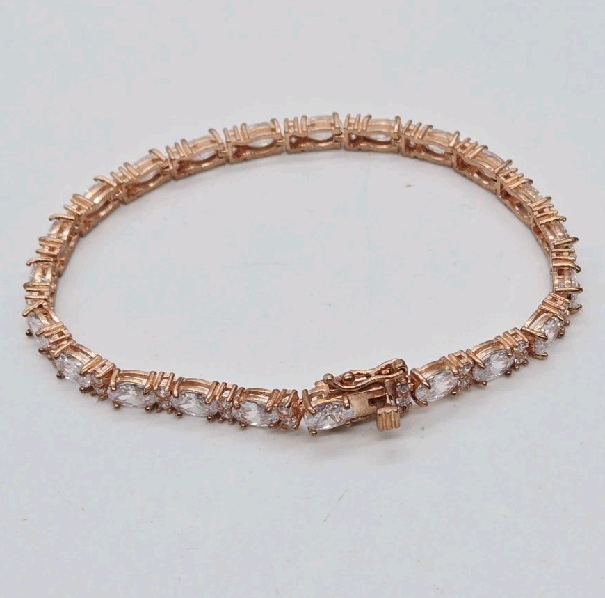 Tennis Bracelet White Oval Crystal rhinestone signed 925 Rose Gold tone 7.25 in