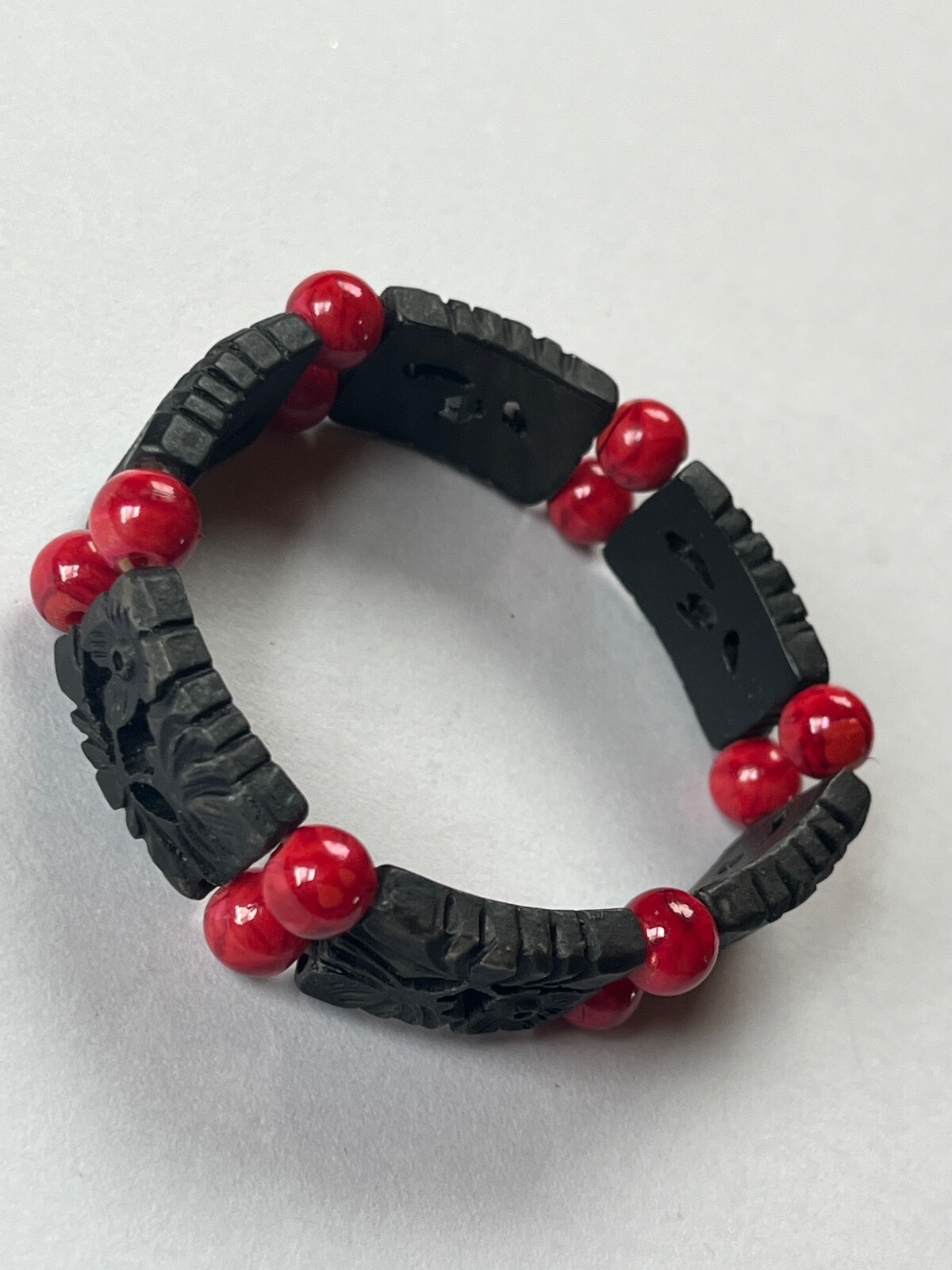 Alternating Carved Black Floral Rectangle & Red Round Plastic Beads Stretch Brac