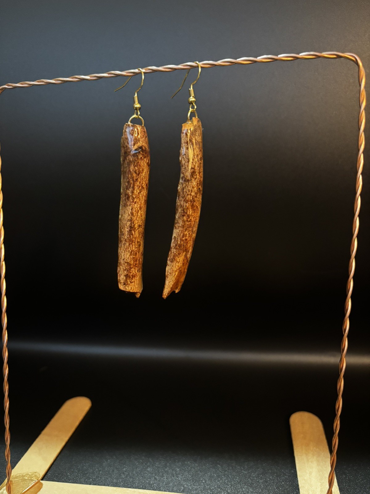 One of a kind jewelry made from real pieces of wood coated in resin