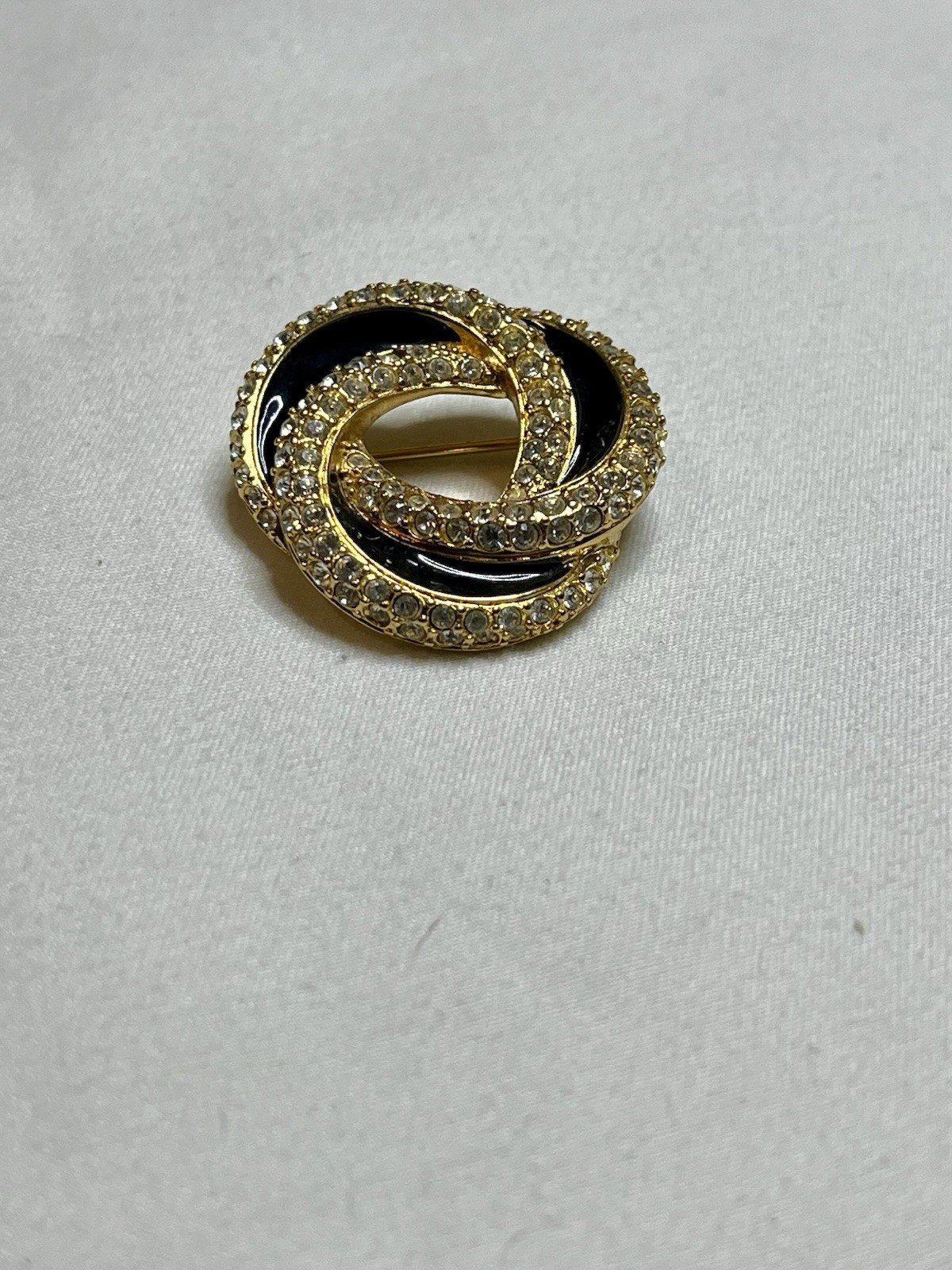 Signed Swarovski Gold Tone Clear Crystal Black Enamel Love Knot Brooch Pin