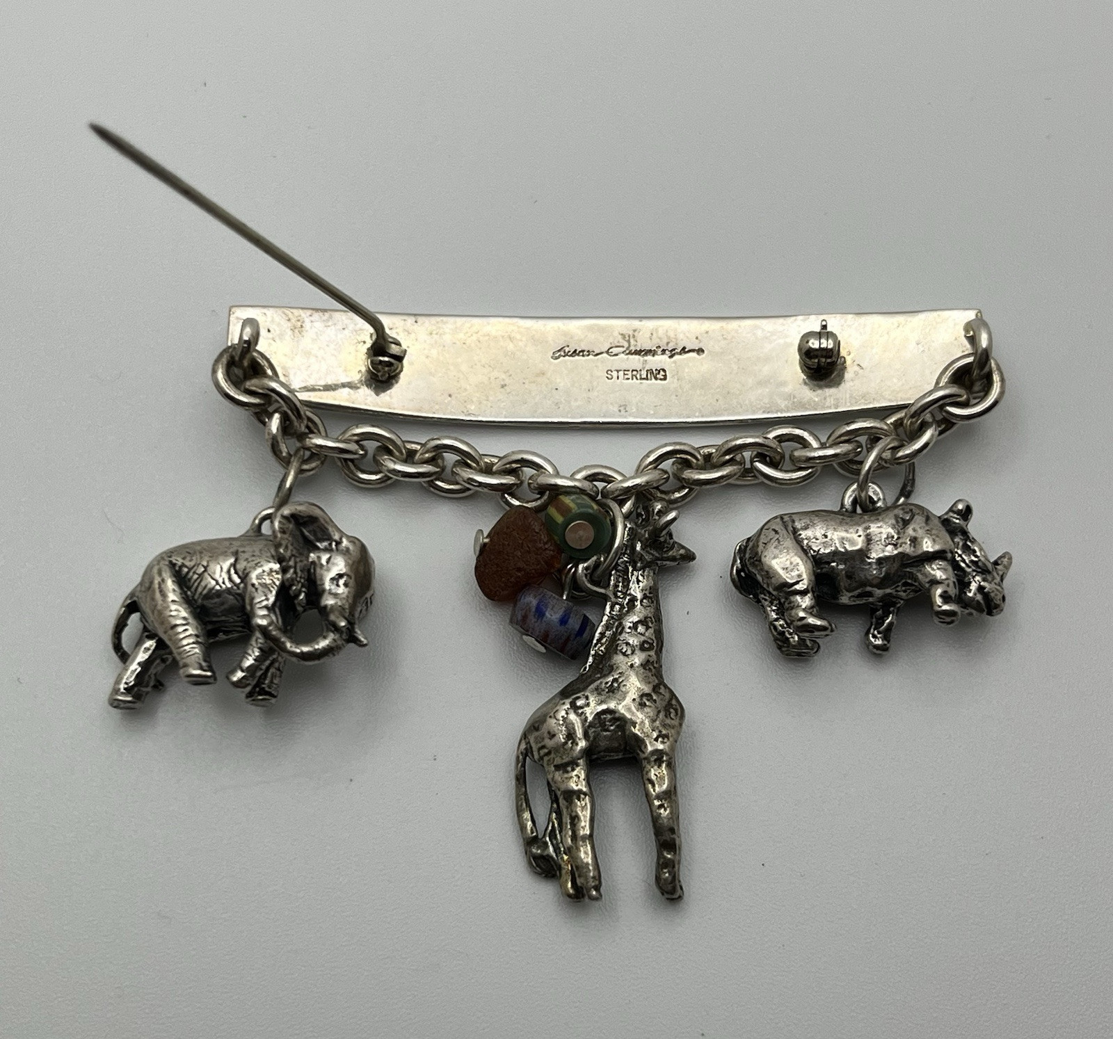 Vintage SUSAN CUMMINGs Safari Theme Sterling Silver Brooch/ Pin with charms!
