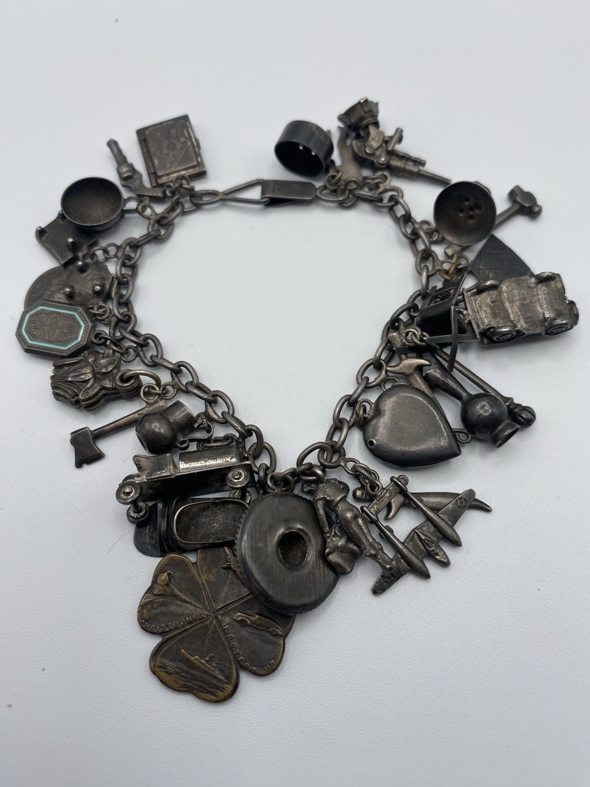 Old Charm Bracelet Sterling Silver, 27 Charms, Fuel Truck, Jeep, Cannon 7 1/2″