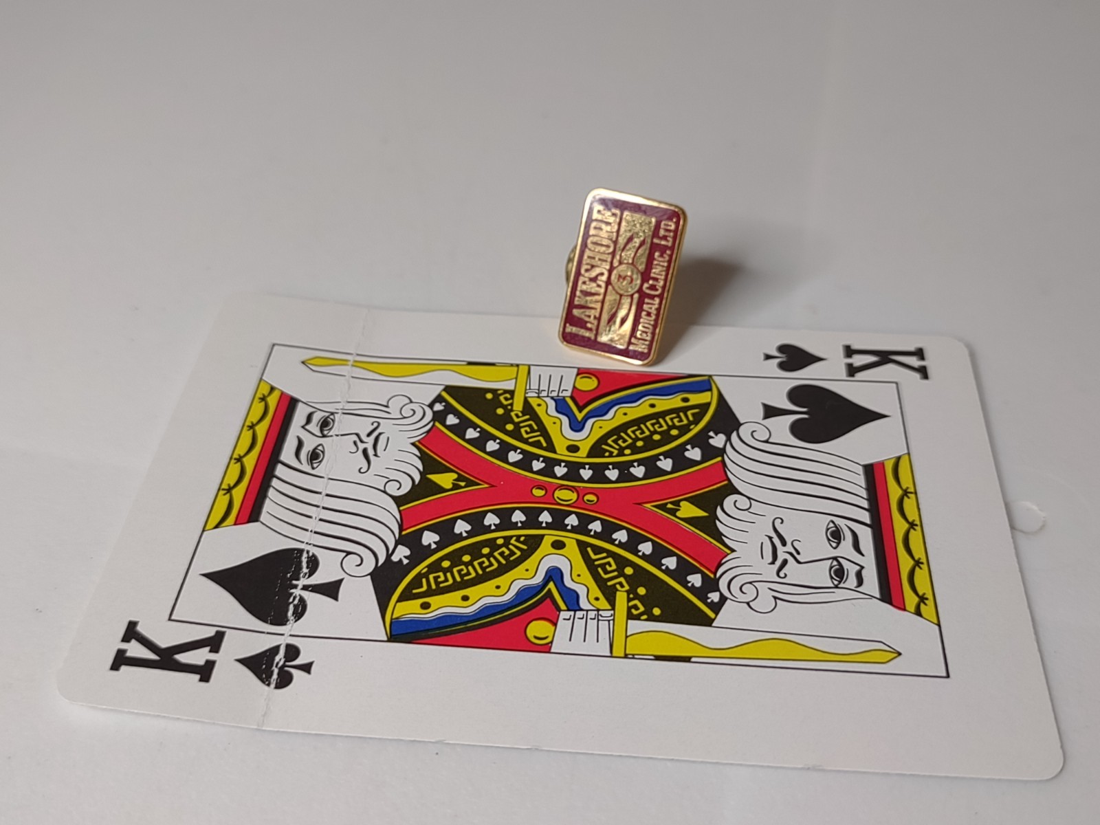 Red And Gold Tone Lakeshore Medical Clinic Pin