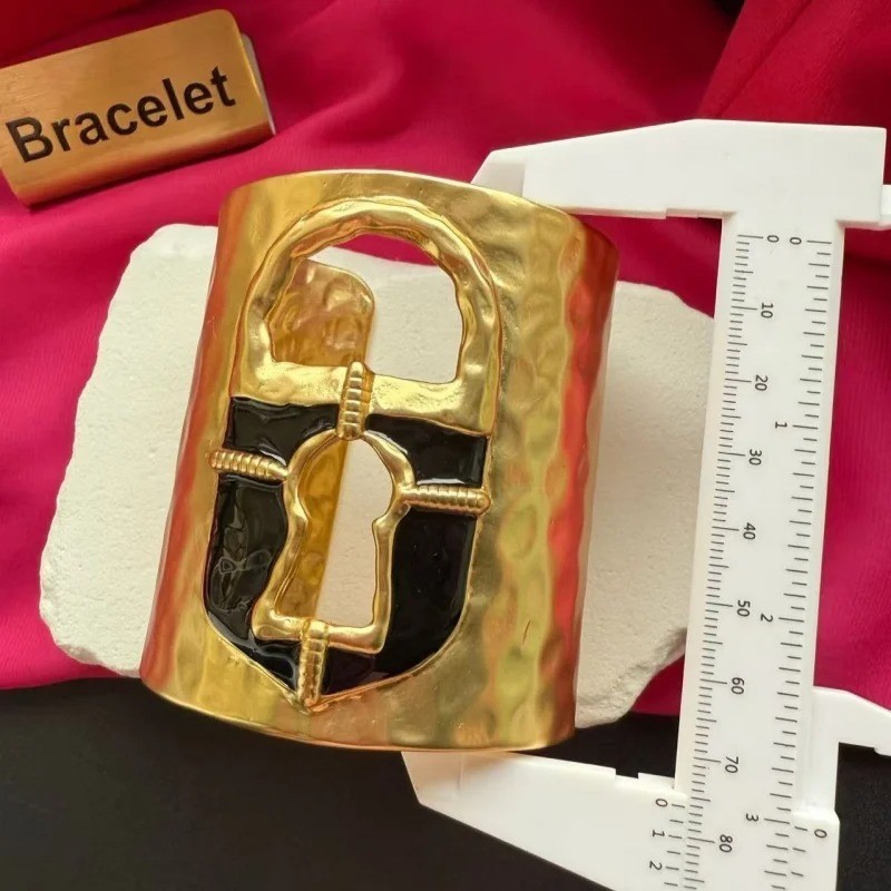 Schiaparelli Black and Gold Keyhole Cuff Bracelet. With Box and Pouch.