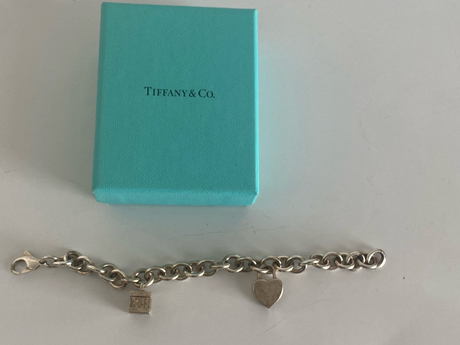 Tiffany & Co. Sterling Silver Charm Bracelet with 2 Charms Length 71/2 Inches