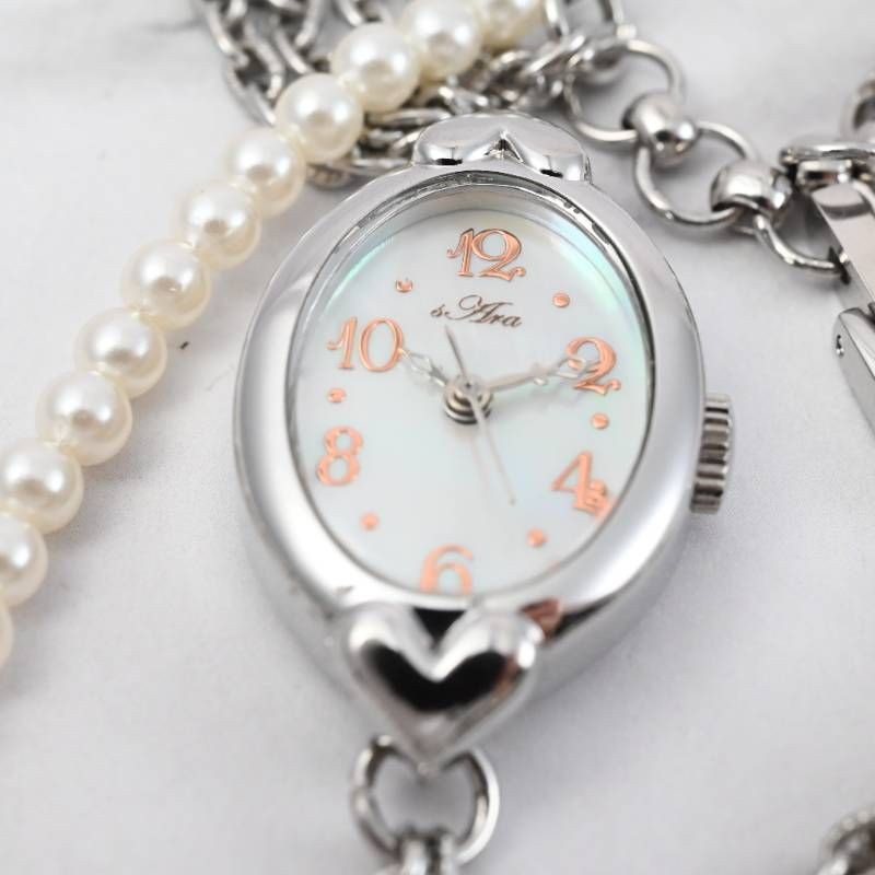 sara ladies’ wristwatch pearl bracelet watch oval shell dial heart motif silver