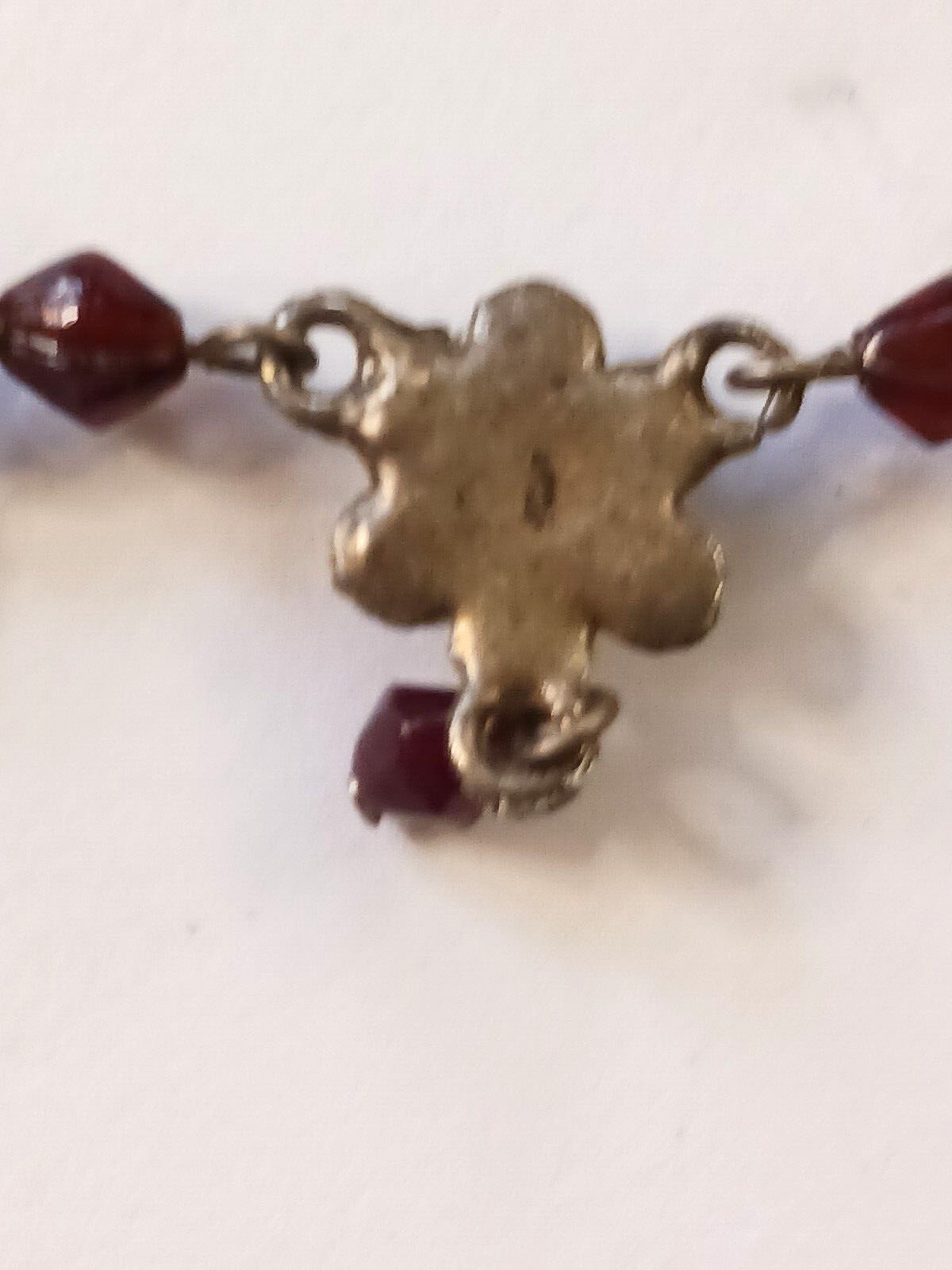 Beautiful silver tone necklace with flowers and red stones. hook clasp. Vintage