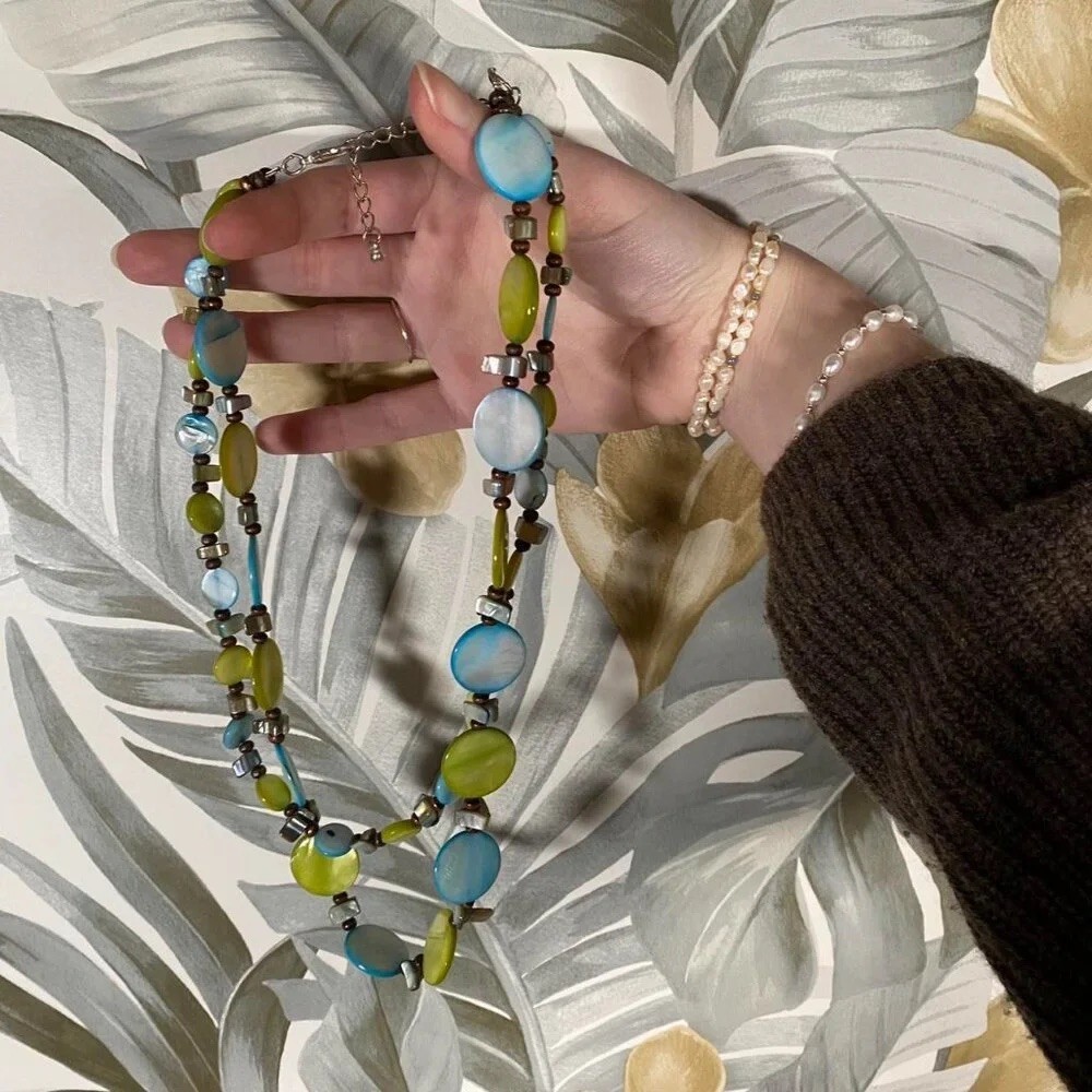 Vintage layered beaded necklace in shades of blue, green, and earthy brown